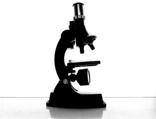 a microscope on a white table