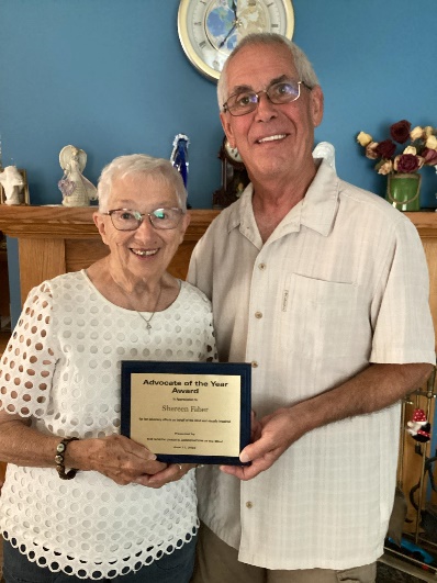 Ruth (Shereen’s mother) and Elton (Shereen’s husband) holding the Advocate of the Year Award.