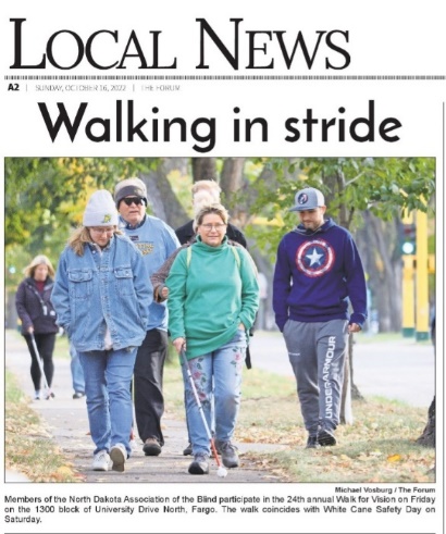 Photo from Fargo Forum, photo of NDAB members participating in the Walk for Vision Day in Fargo.