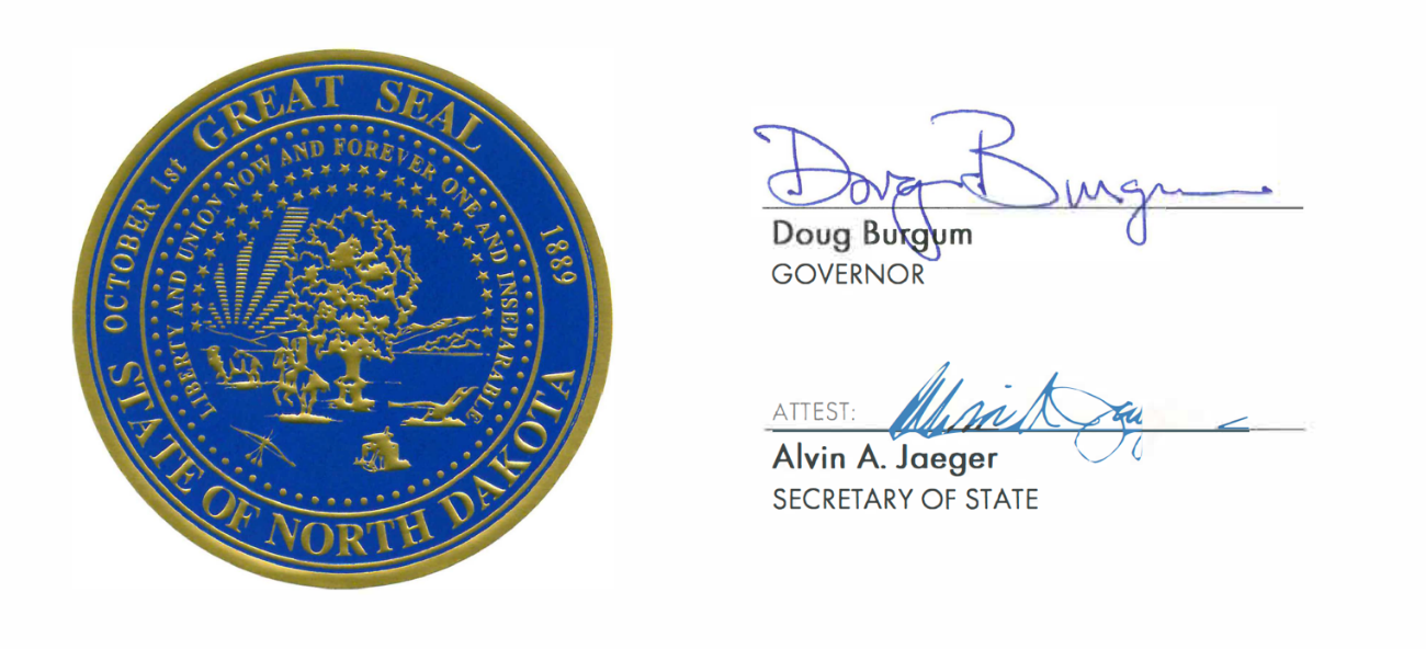 The photo is of the Great Seal of North Dakota which is a blue background with gold lettering stating "Great Seal State Of North Dakota, October 1, 1889.  Liberty and union Now and Forever One and Inseperable."  The photo also has the signatures of Governor Doug Burgum and Secretary of State Alvin Jaeger.