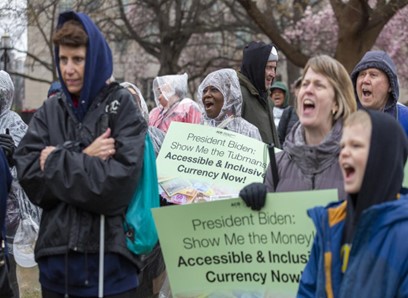 ACB Currency Rally in Lafayette Square with many people holding signs
